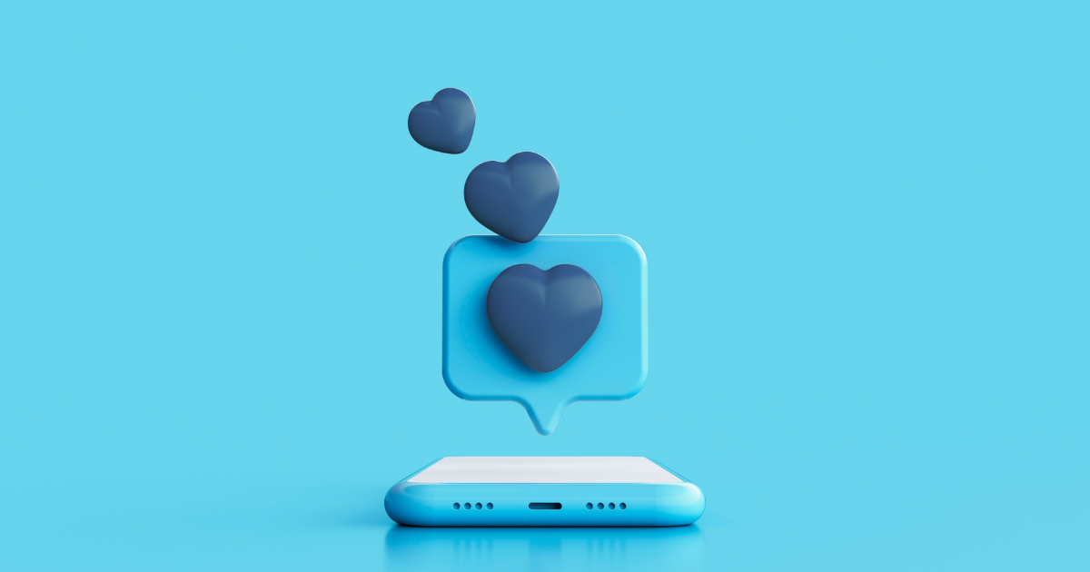 phone laying flat with hearts coming out of the screen