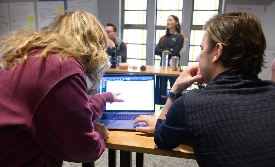 Team looking at computer screen