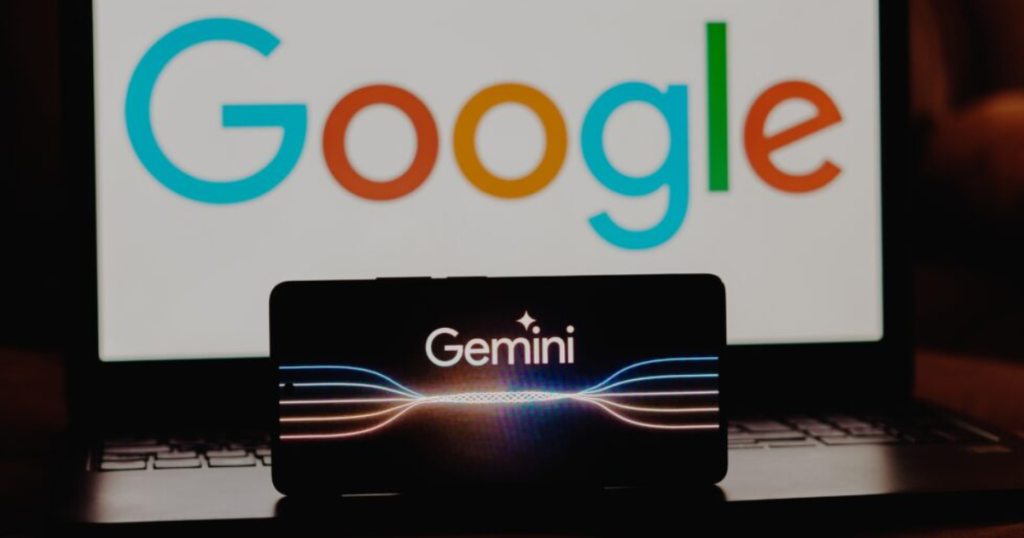 gemini logo on phone in front of Google logo on laptop