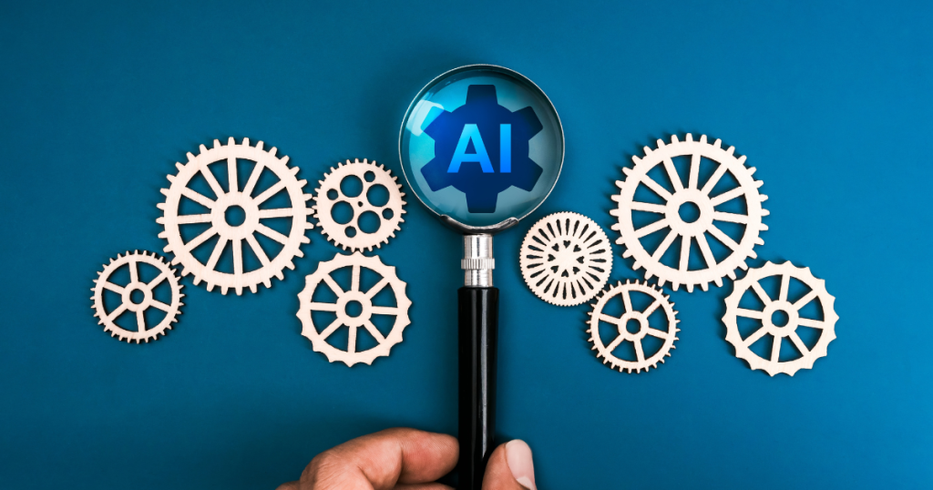 Magnifying glass highlighting “AI” over interlocking gears