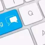 A keyboard with one key highlighted in bright blue, labeled "blog"